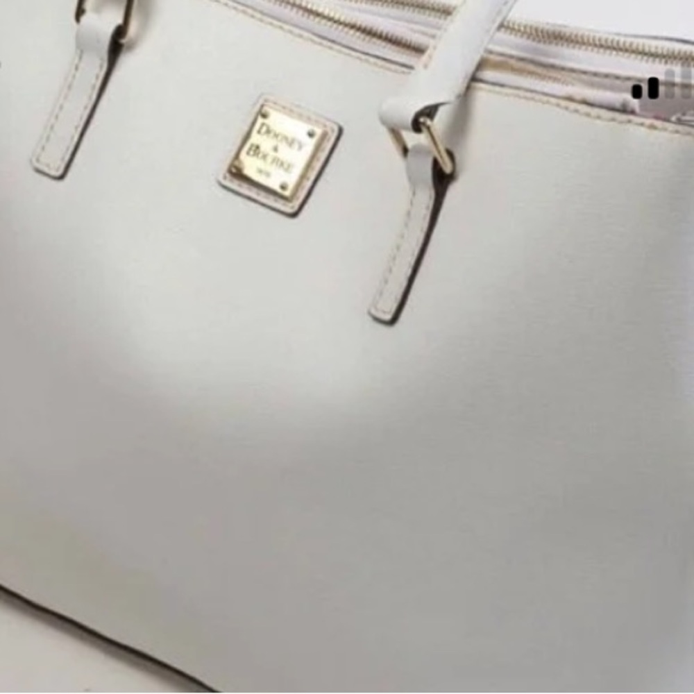 Dooney and Bourke- white bag with red interior. Lots of compartments and space